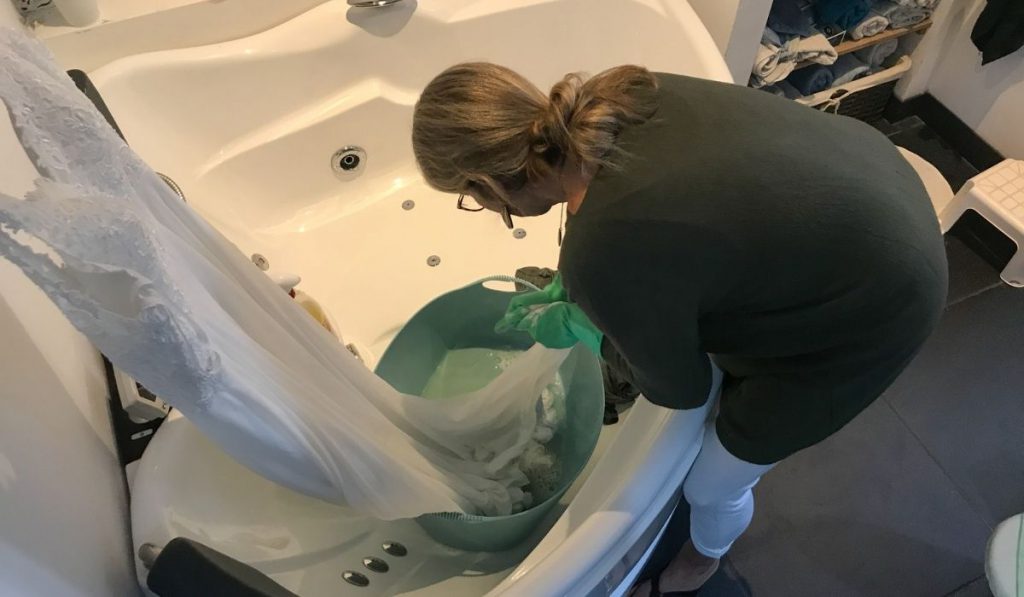 a girl cleaning a wedding dress